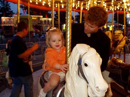Eva and Mike on the Merry-Go-Round. Susan Shie 2006.