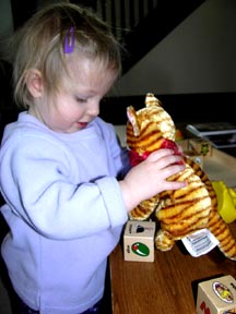 Eva training her cat Willy.Susan Shie 2006.
