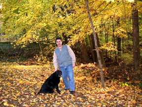 Jimmy and Hattie in the leaves.   Susan 
                                Shie 2005.