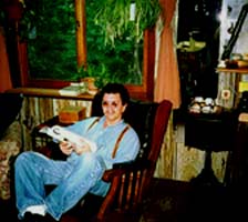 Jimmy relaxes in a chair.