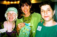Susan Shie, at left, and Robin Schwalb, at right, present Maya with her GREEN QUILTS award.