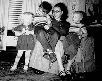 Me, Larry, Mom, and Jimmy Shie, in the early 50's.