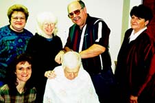 Larry gives Dad a Christmas haircut.