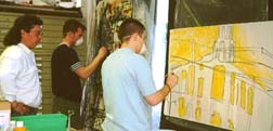 Jimmy helps Brett and Marshall airbrush.