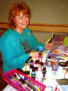 Sue DeSalvatore makes art in our class.
