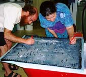 Michael and Debra drawing on potato starch.