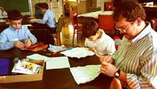 Sewing sandwiches together.