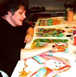 Frances Alford painting fabric panels at camp.