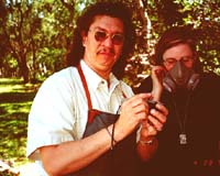Jimmy shows Julie some airbrush stuff.Susan Shie 2001.