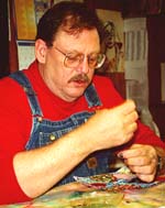 Bob learning to hand sew.