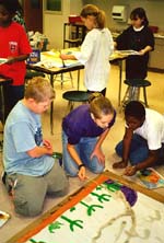 Students painting murals. Susan Shie 2001.