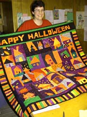 Tonya and her Halloween quilt.�Susan Shie 2002.