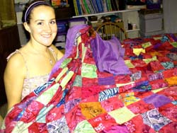 Danielle and her quilt.�Susan Shie 2002.