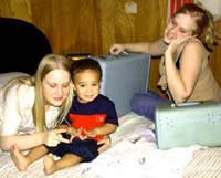 Julie, Omari, and Aimee leaving for Florida. Susan Shie 2002.