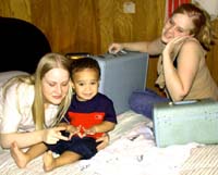 Julie, Omari, and Aimee leaving for Florida. Susan Shie 2002.