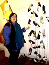 Maxine shows me the Shoe Show. Susan Shie 2002.