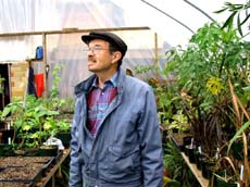 Stan in his new greenhouse. Susan Shie 2002.