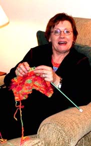Sonja knitting for her granddaughters.Susan Shie 2004.